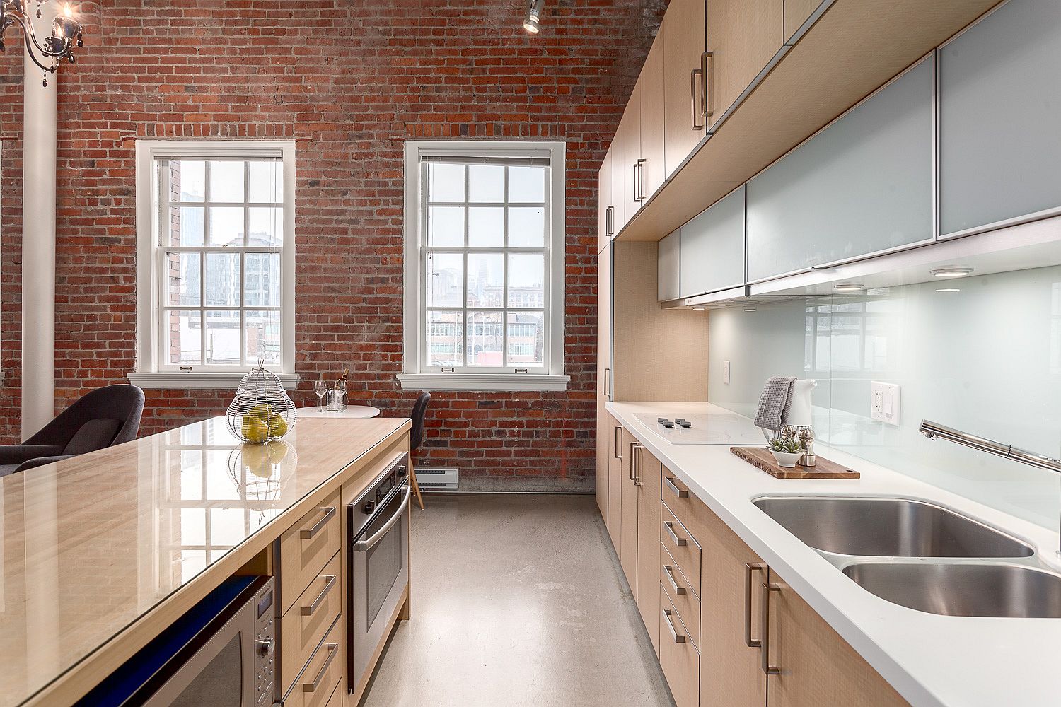 Exposed brick wall also gives the kitchen a fabulous modern-industrial look