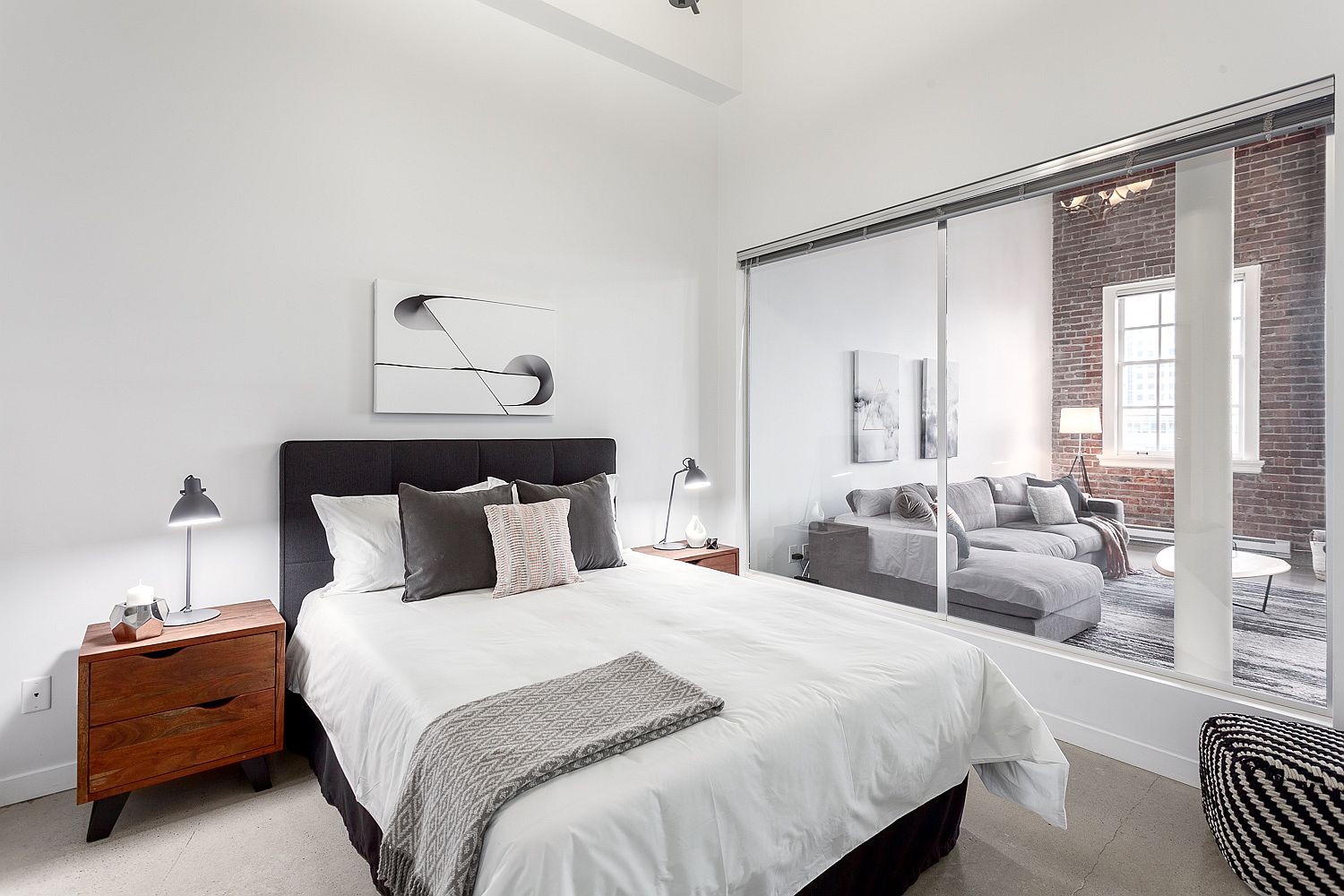 Glass windows connect the bedroom with the living area