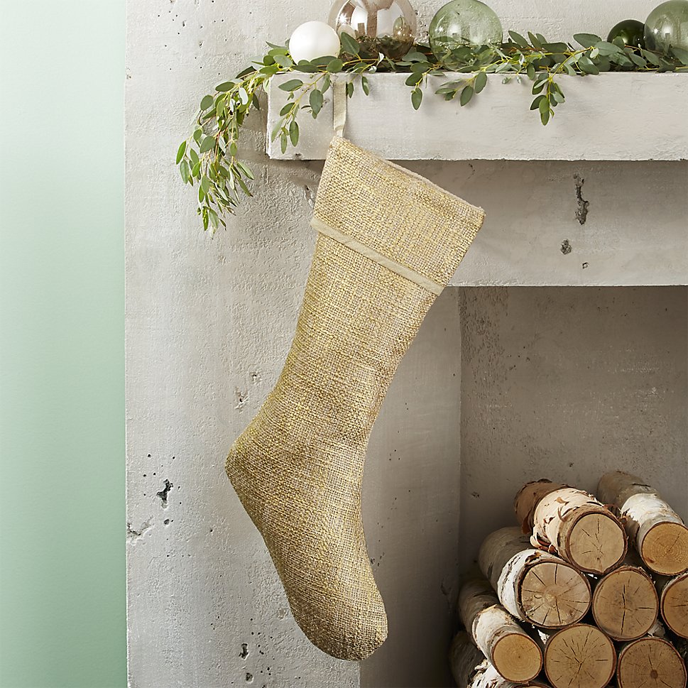 Gold stocking on a holiday mantel