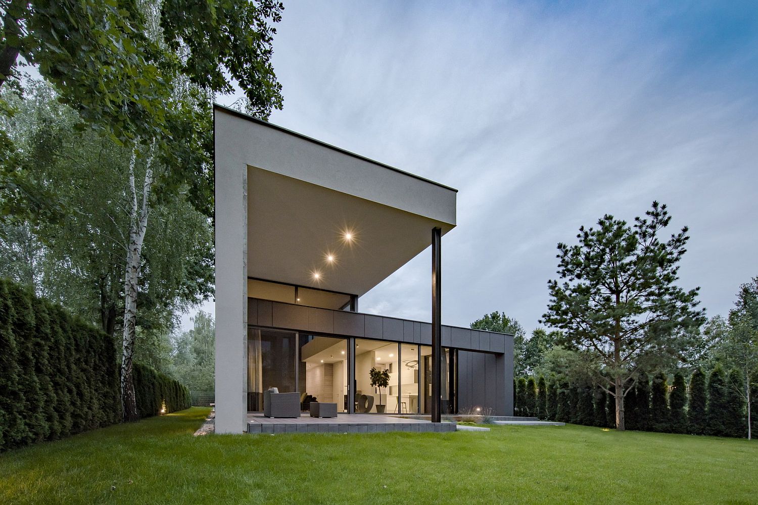 Gray and elegant exterior of the home along with a lovely garden