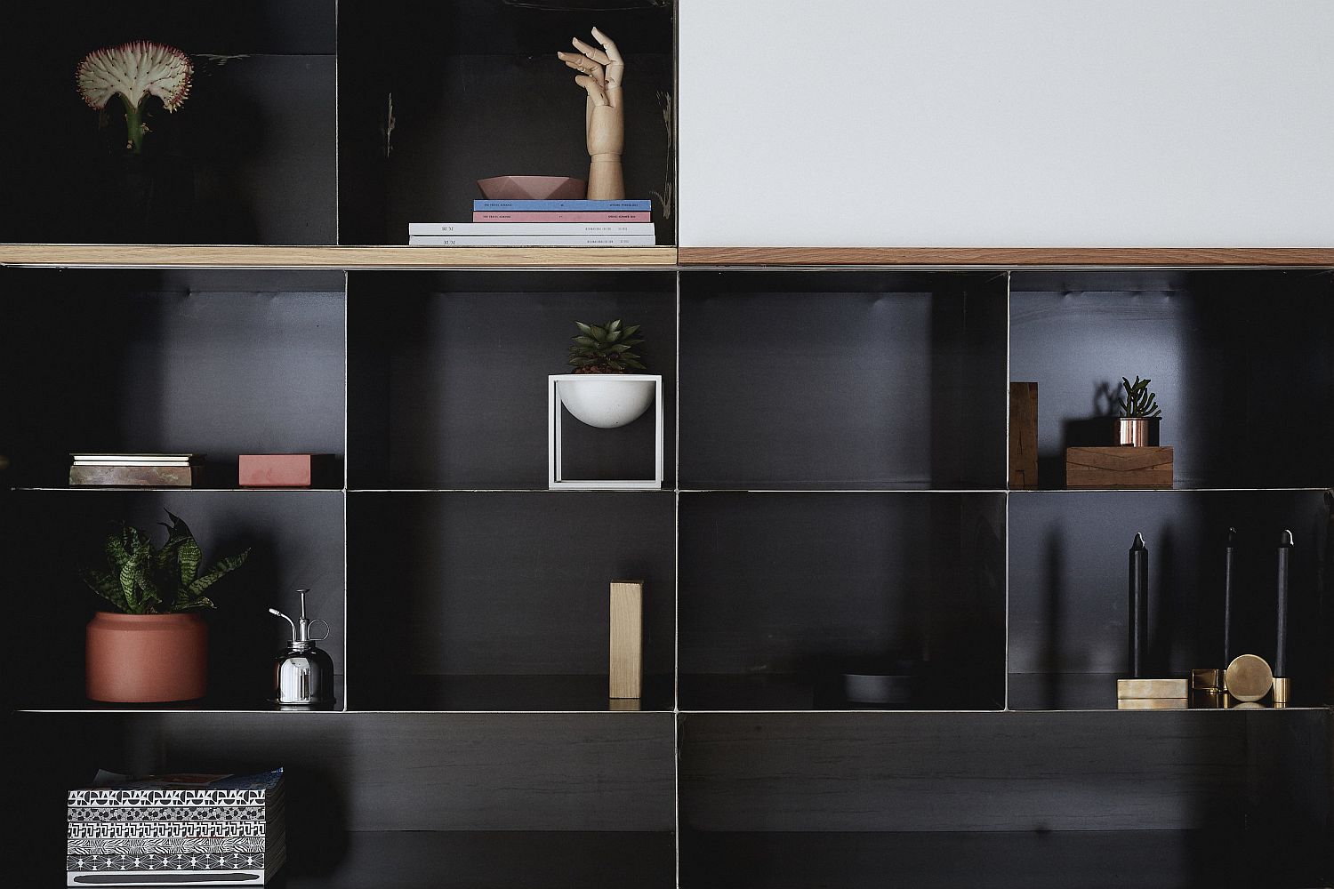 Living room entertainment unit brings a touch of black to the living space