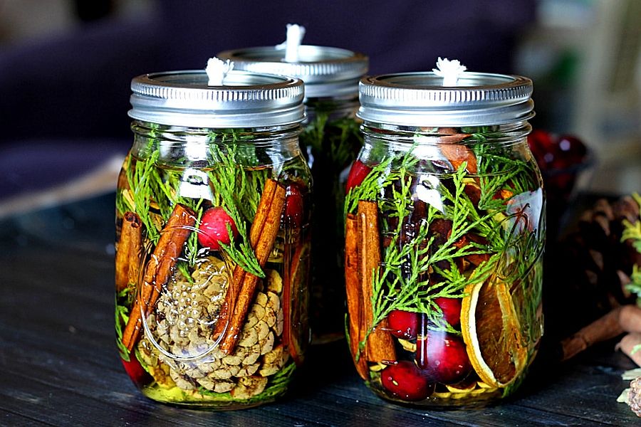 2 mason jar oil candle lamps filled with botanicals