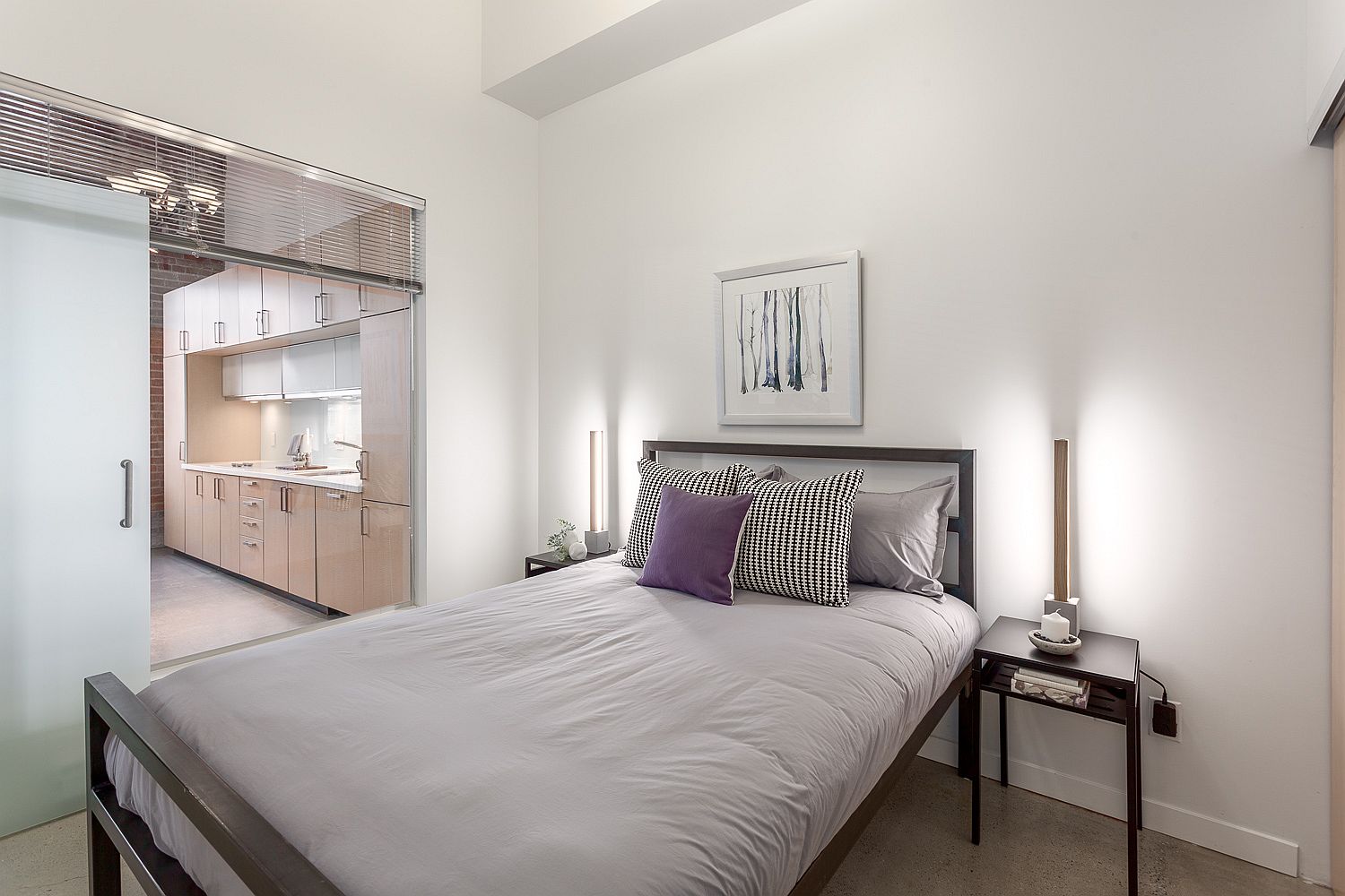 Modern-bedroom-in-white-with-slim-bedside-tables-and-even-lighting