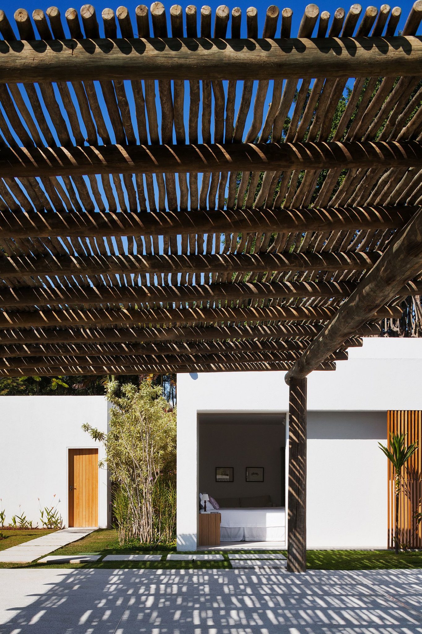 Natural pergola structure offers shade from midday sun