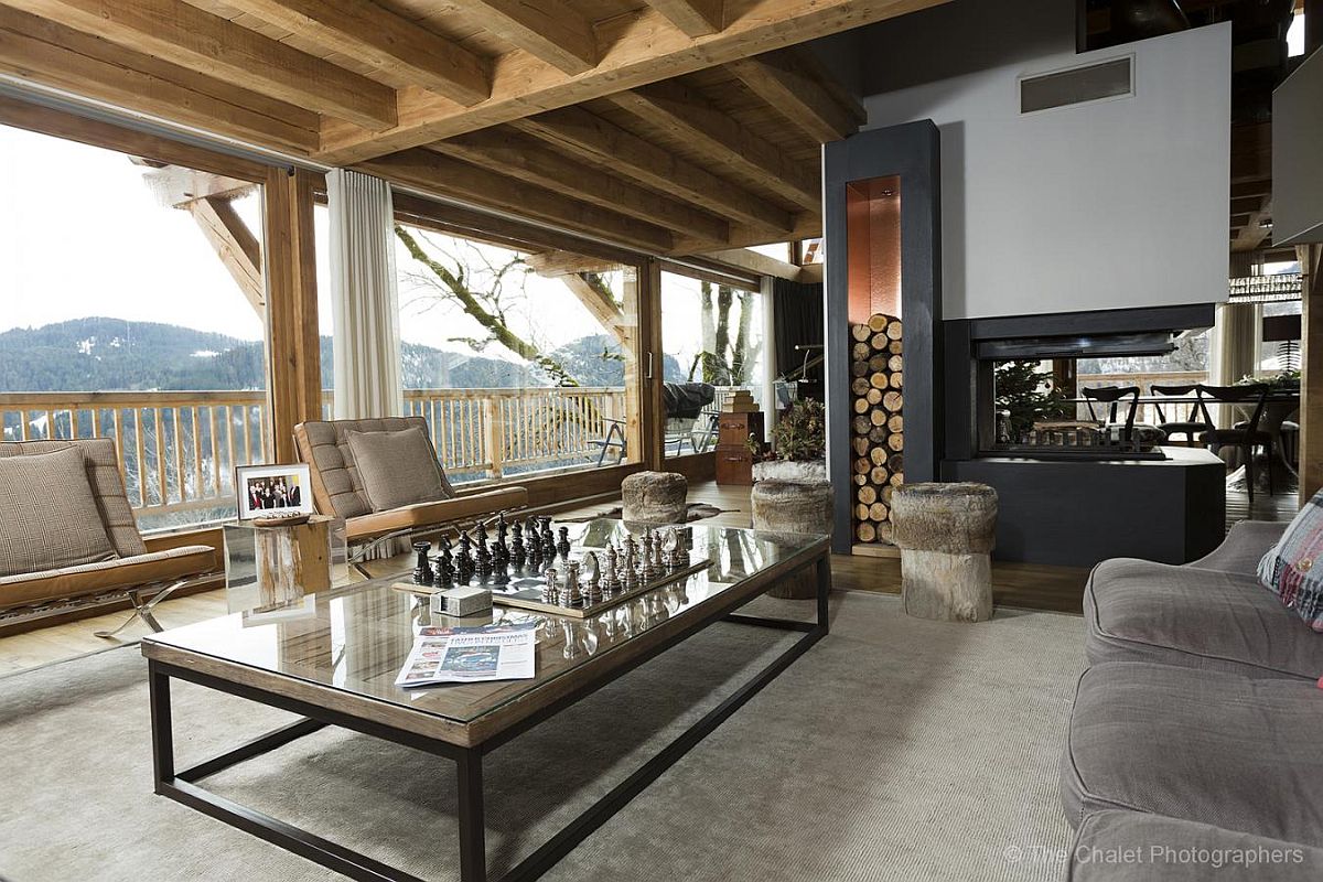 Open interior and living area of the chalet offers amazing views of the landscape beyond