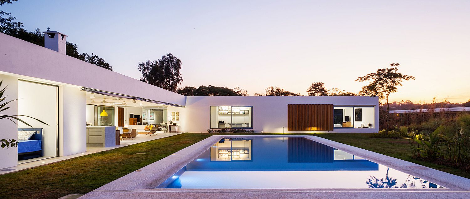 Open living area at the center and the bedrooms in the corer open up into the central pool area