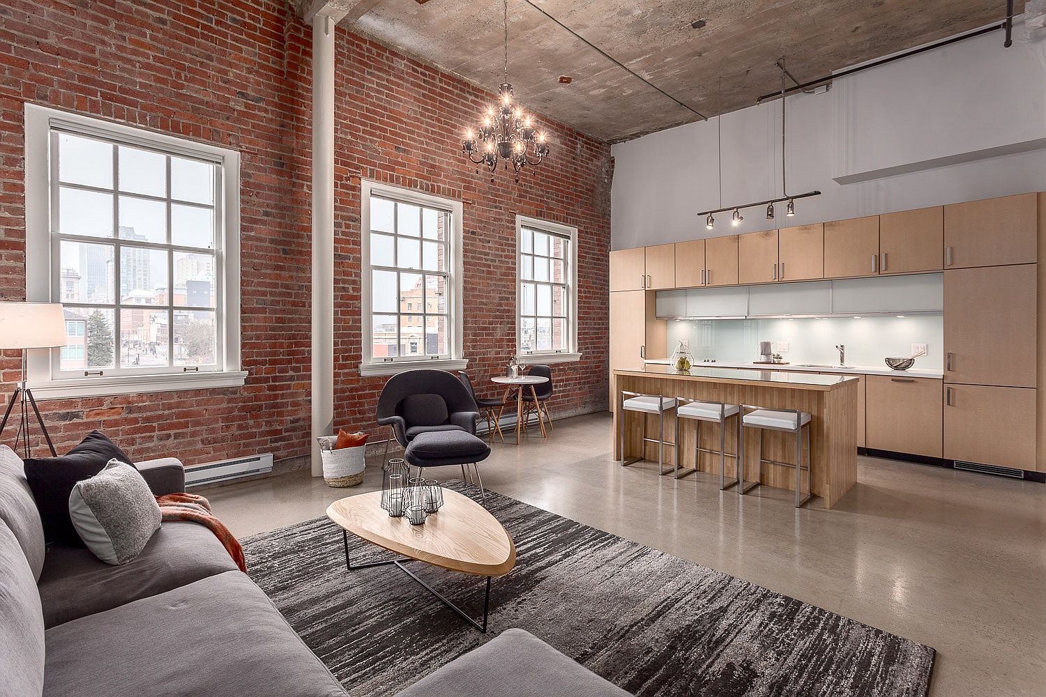 Original restored brick and classical windows inside the apartment