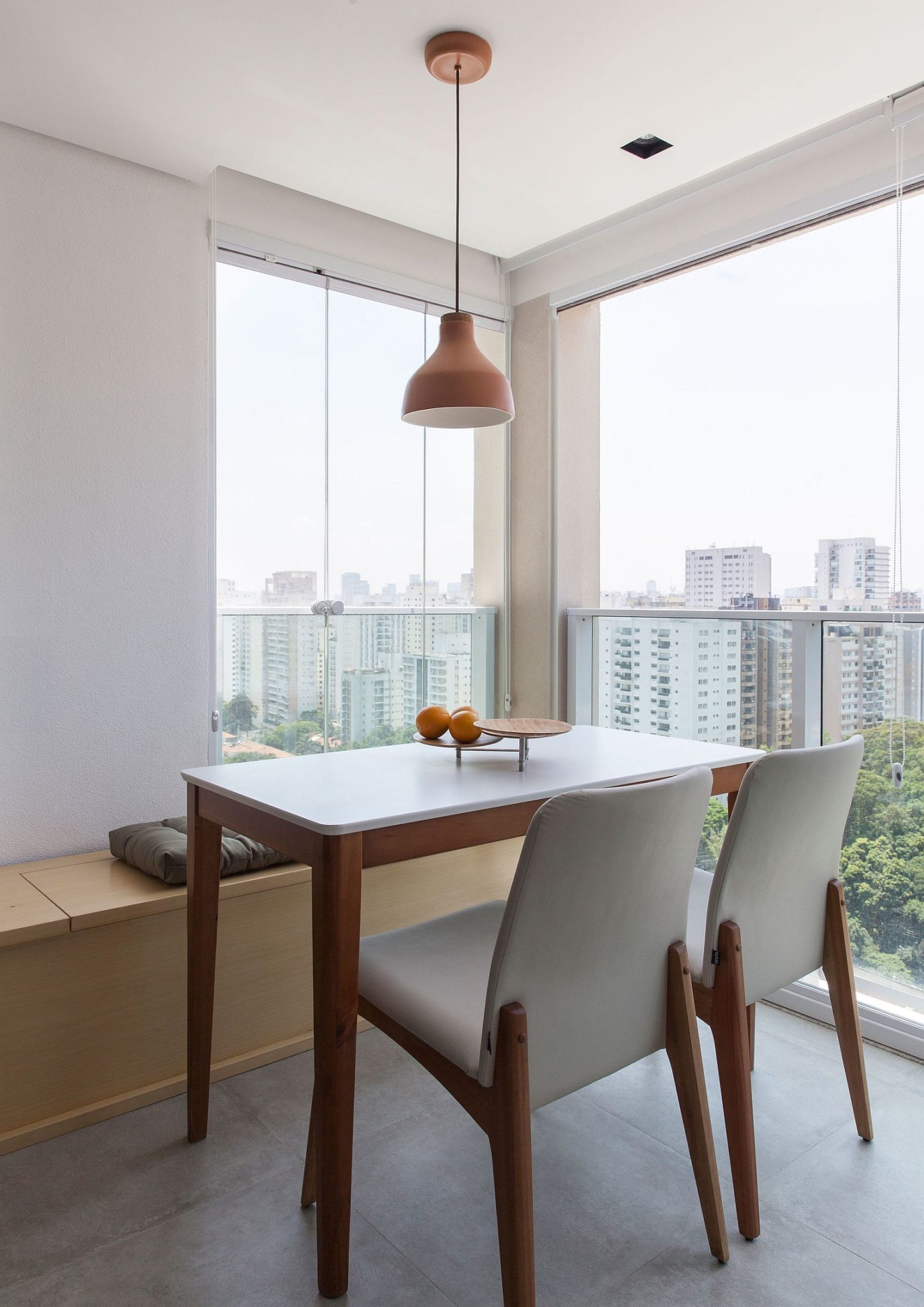 Small dining area in the corner with wooden bench and wonderful views