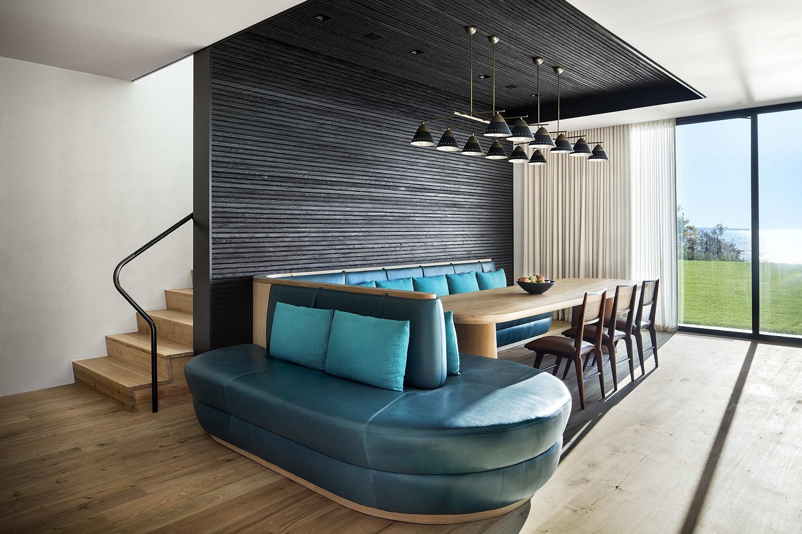 Stunning banquet dining in turquoise blue and minimal wooden table