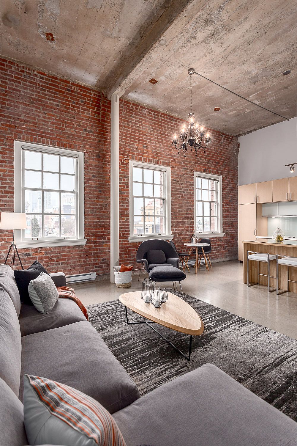 Tall-interiors-give-the-modern-industrial-apartment-a-visually-spacious-and-cheerful-ambiance