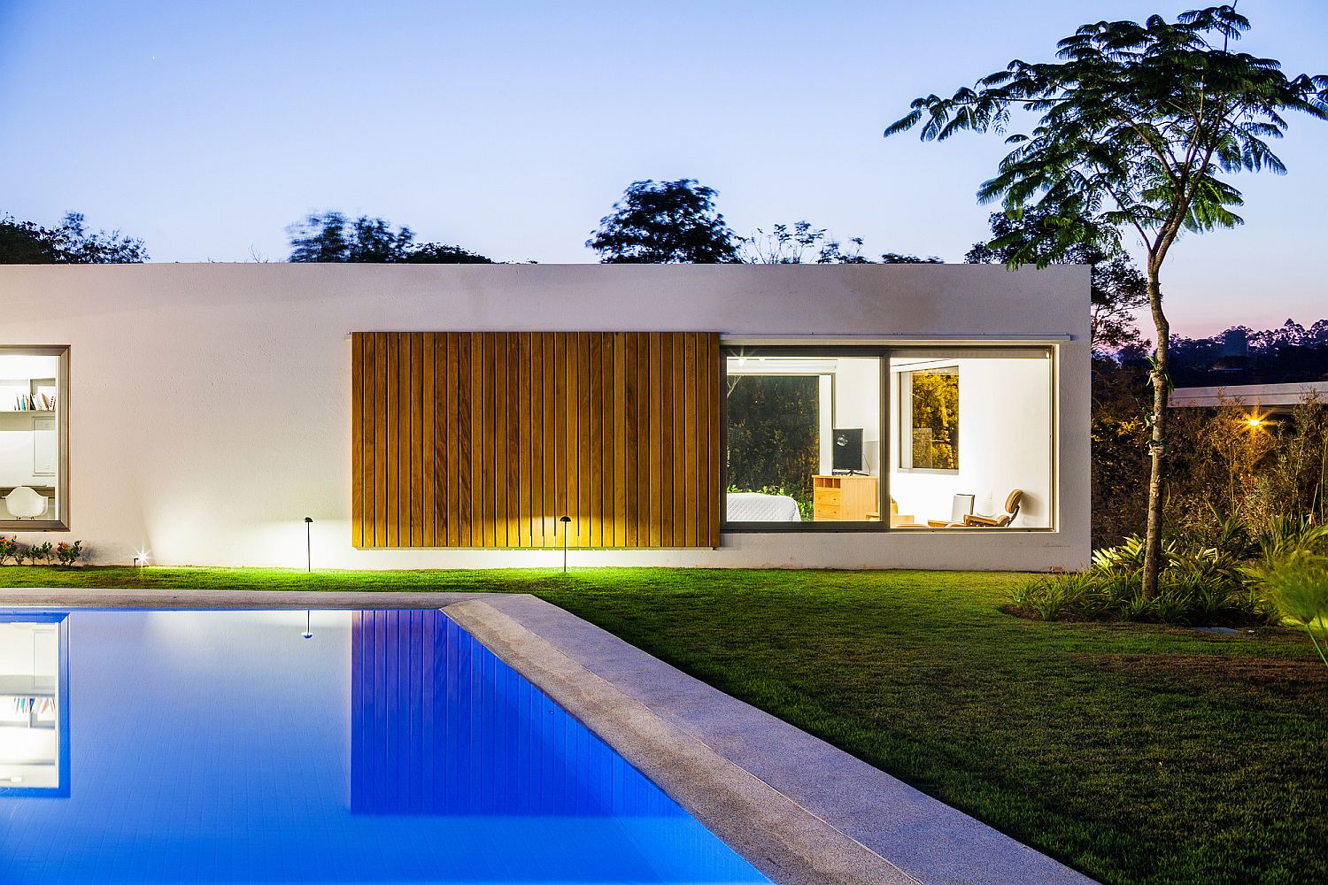 View of the bedroom from the pool area and the central courtyard