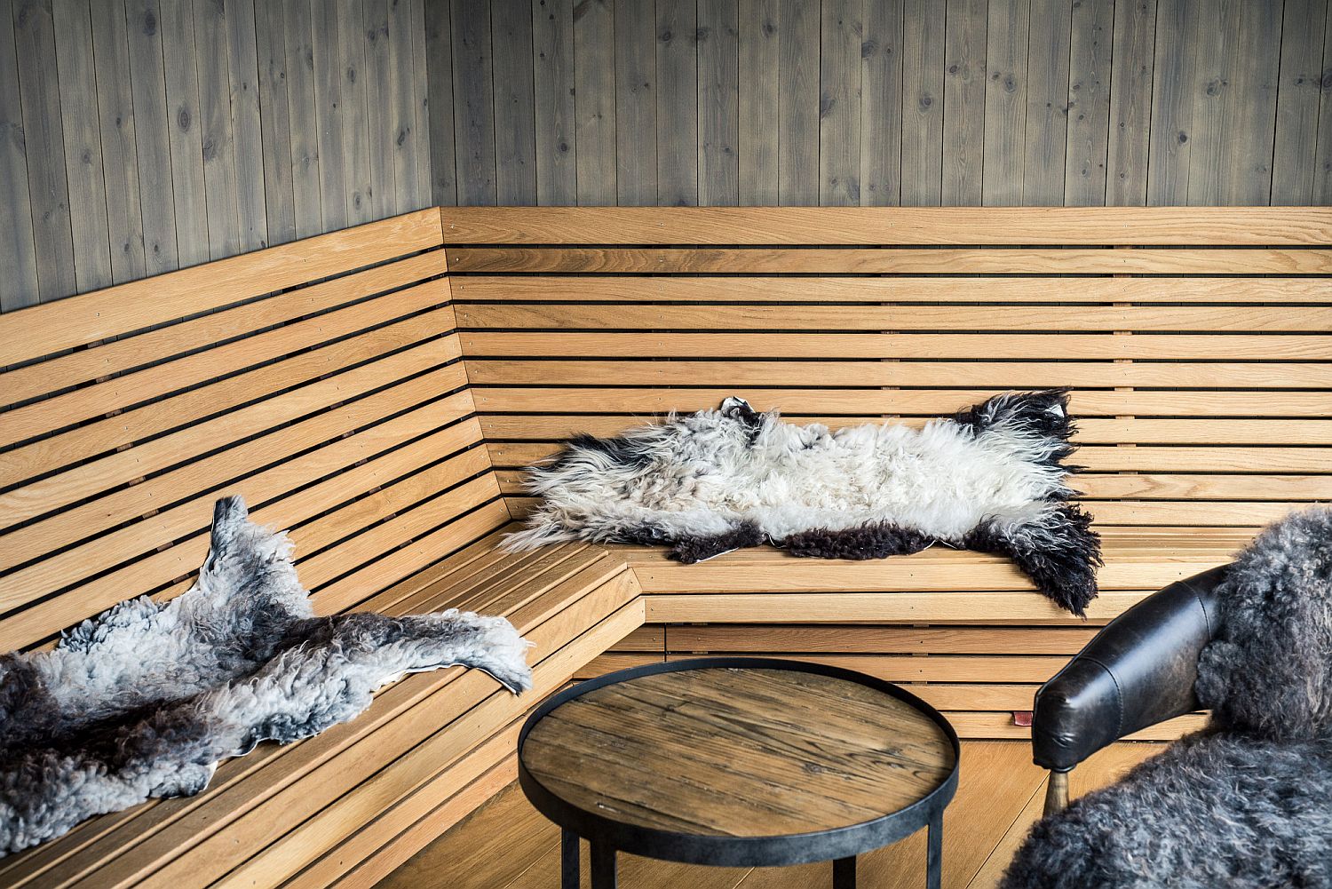 Wooden seating inside the cozy Norwegian cabin