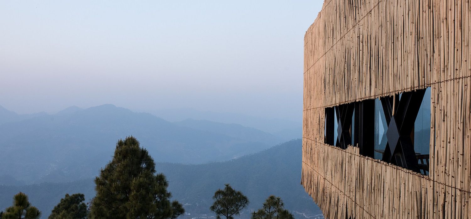 Bamboo cladding of the top level gives the hotel its rustic charm