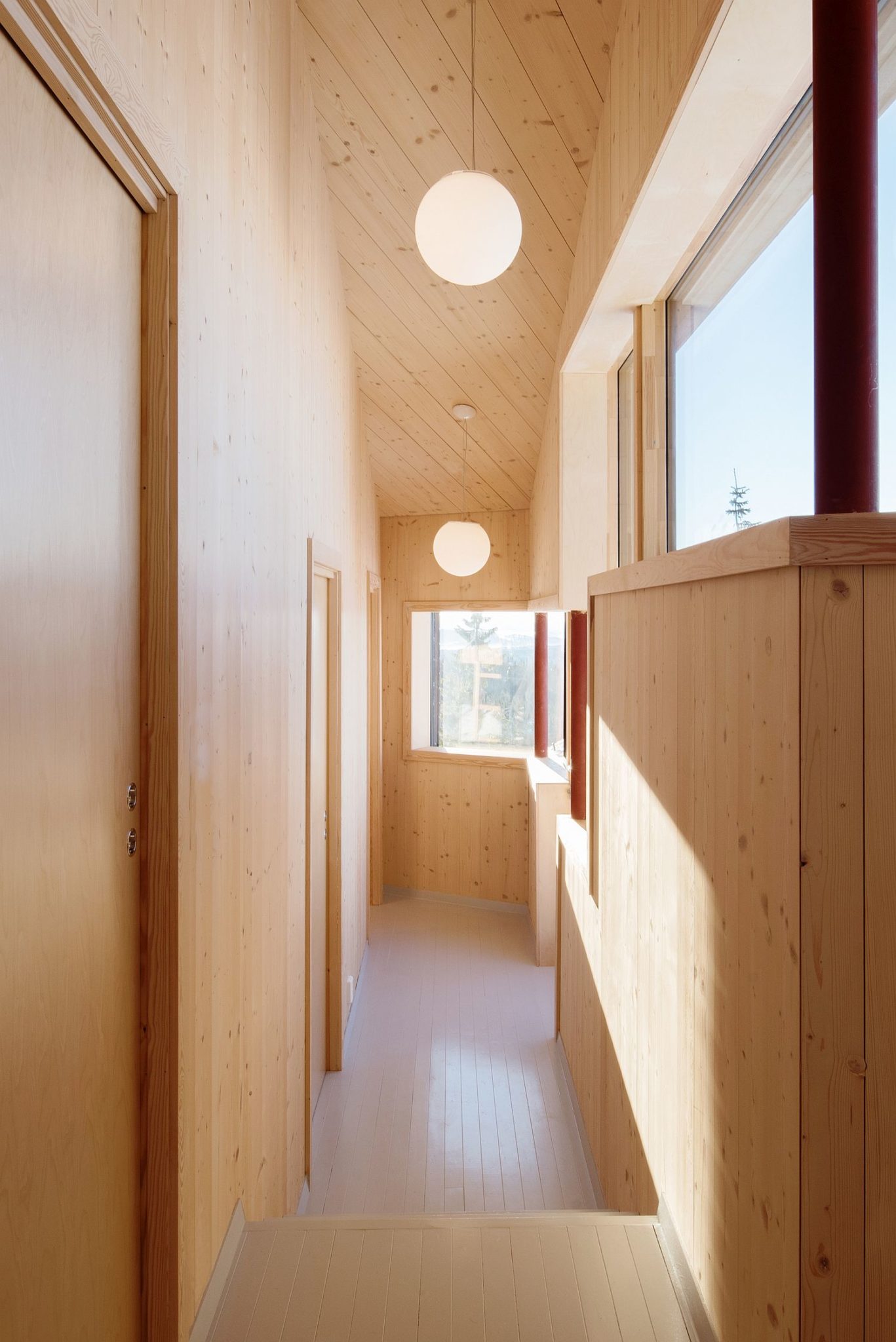 Beautifully illuminated hallway of the modern cabin in Norway