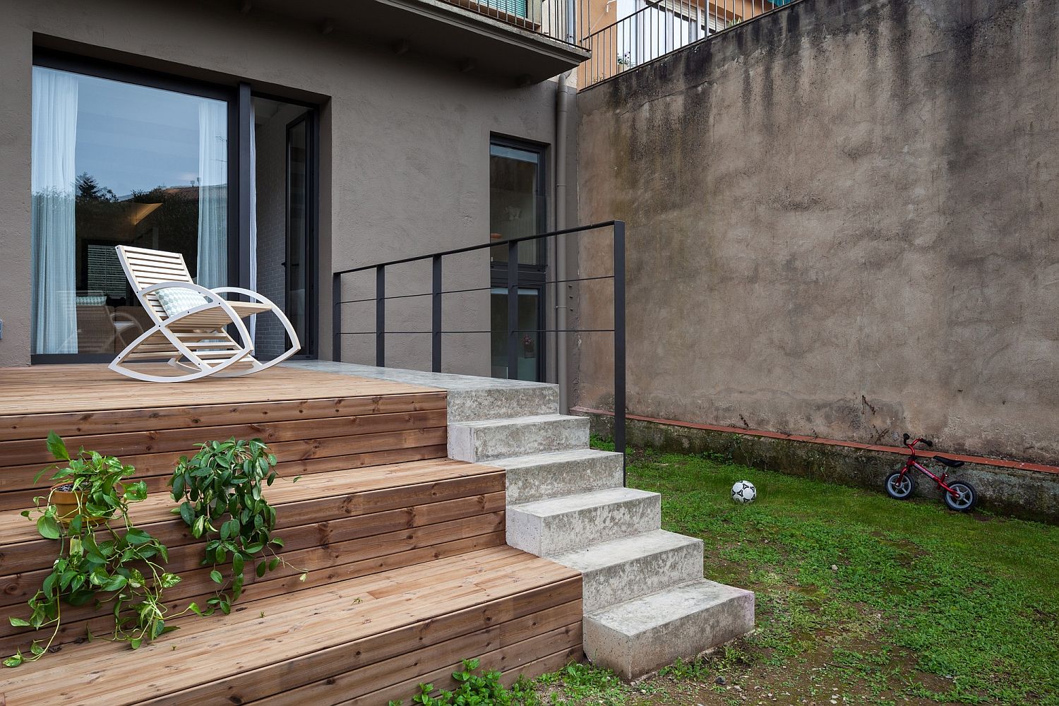 Concrete carpet runs through the house and even to the deck outside