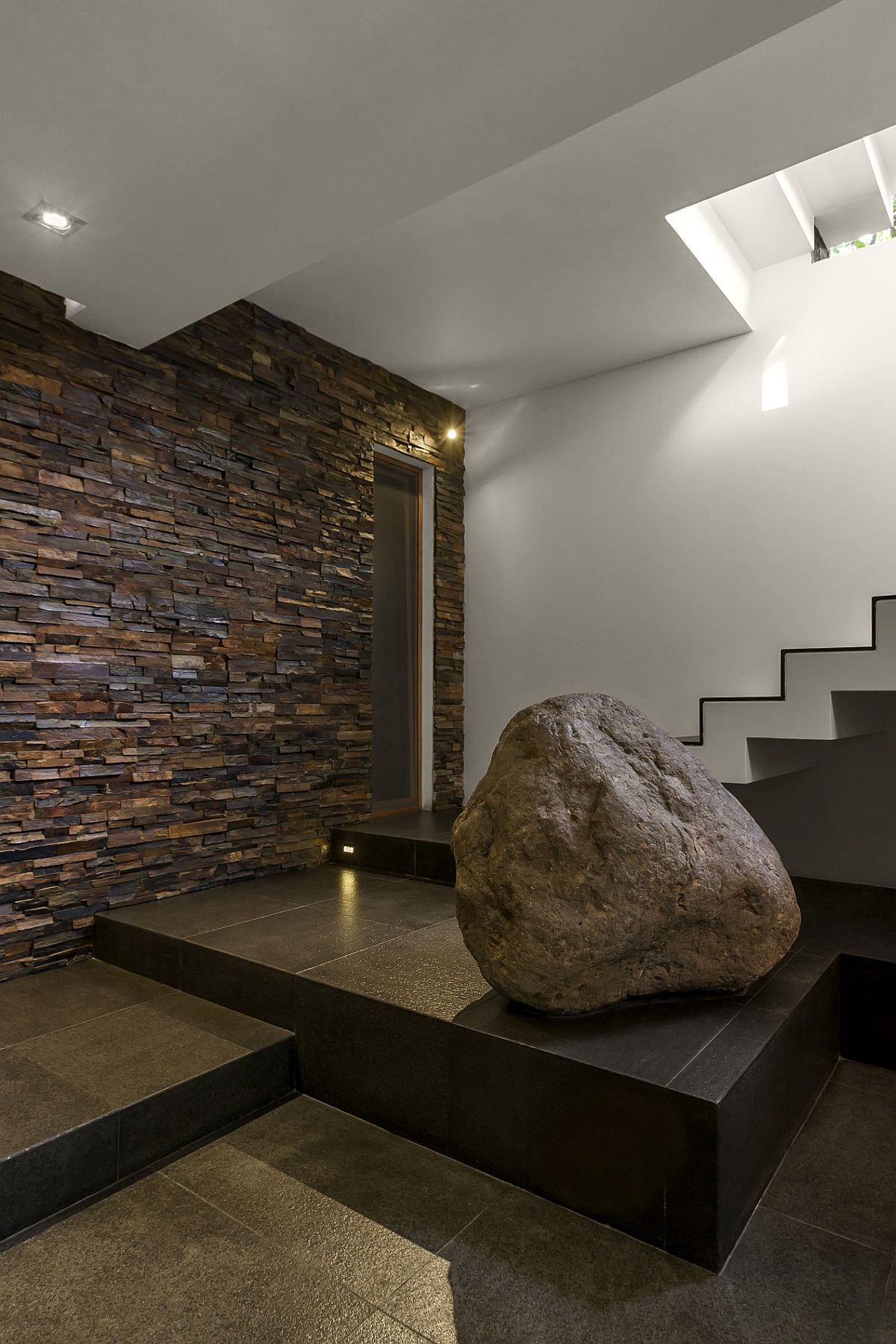 Contemporary home with stone accent wall at the entrance