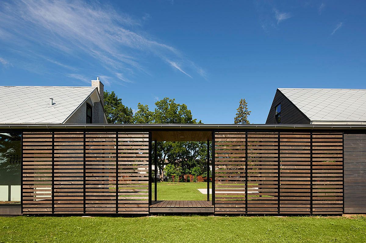 Covered walkway connects the two units of the Foster Road Retreat