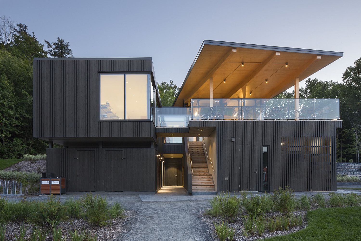 Dark exterior of the building draws inspiration from the landscape around it