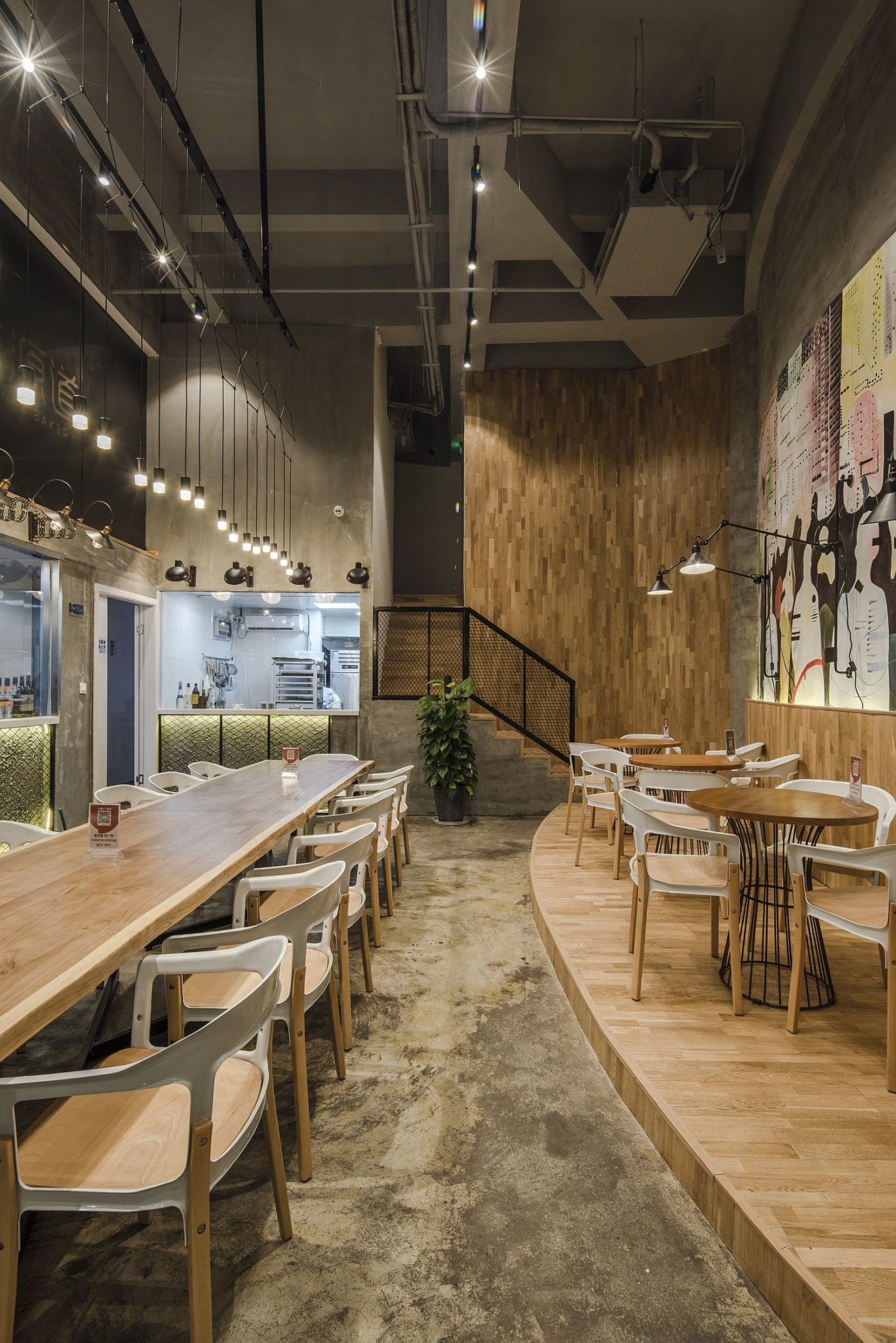 Large dining area and industrial lighting provide a wonderful ambiance