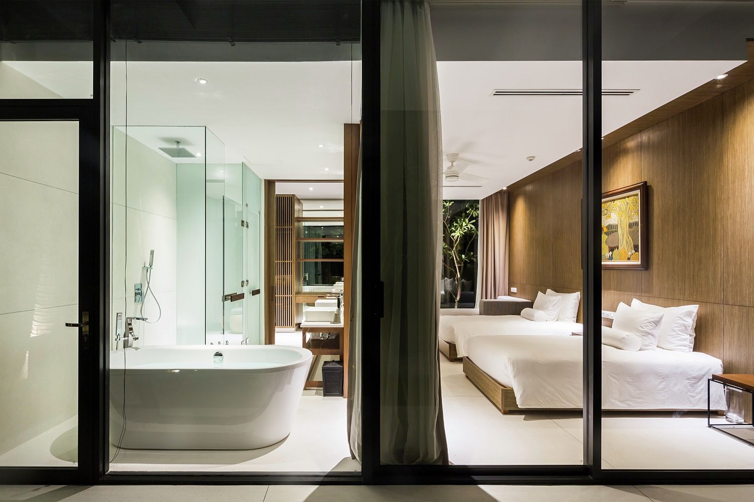 Lavish master bedroom with freestanding bathtub in the corner