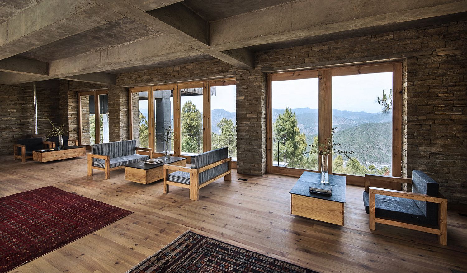 Locally sourced materials and exposed concrete shape the common area of the hotel