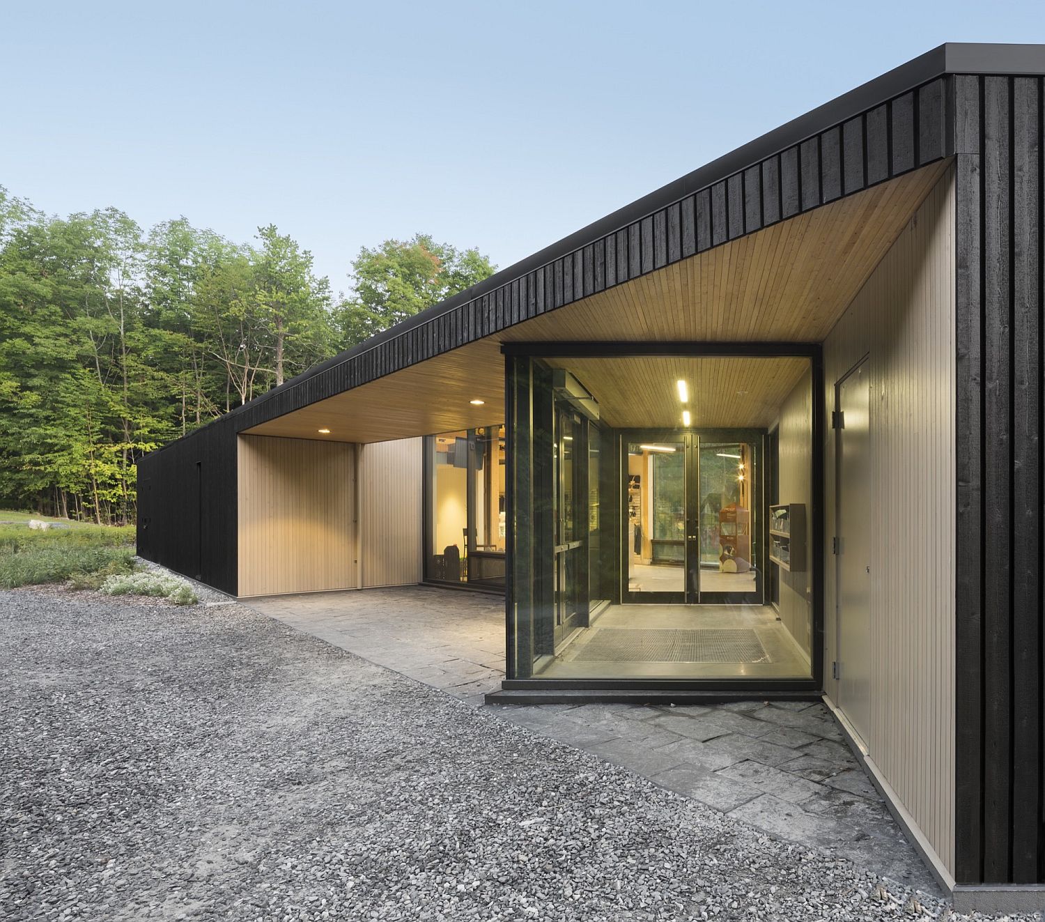 Lovely use of glass walls and windows bring in ample natural light