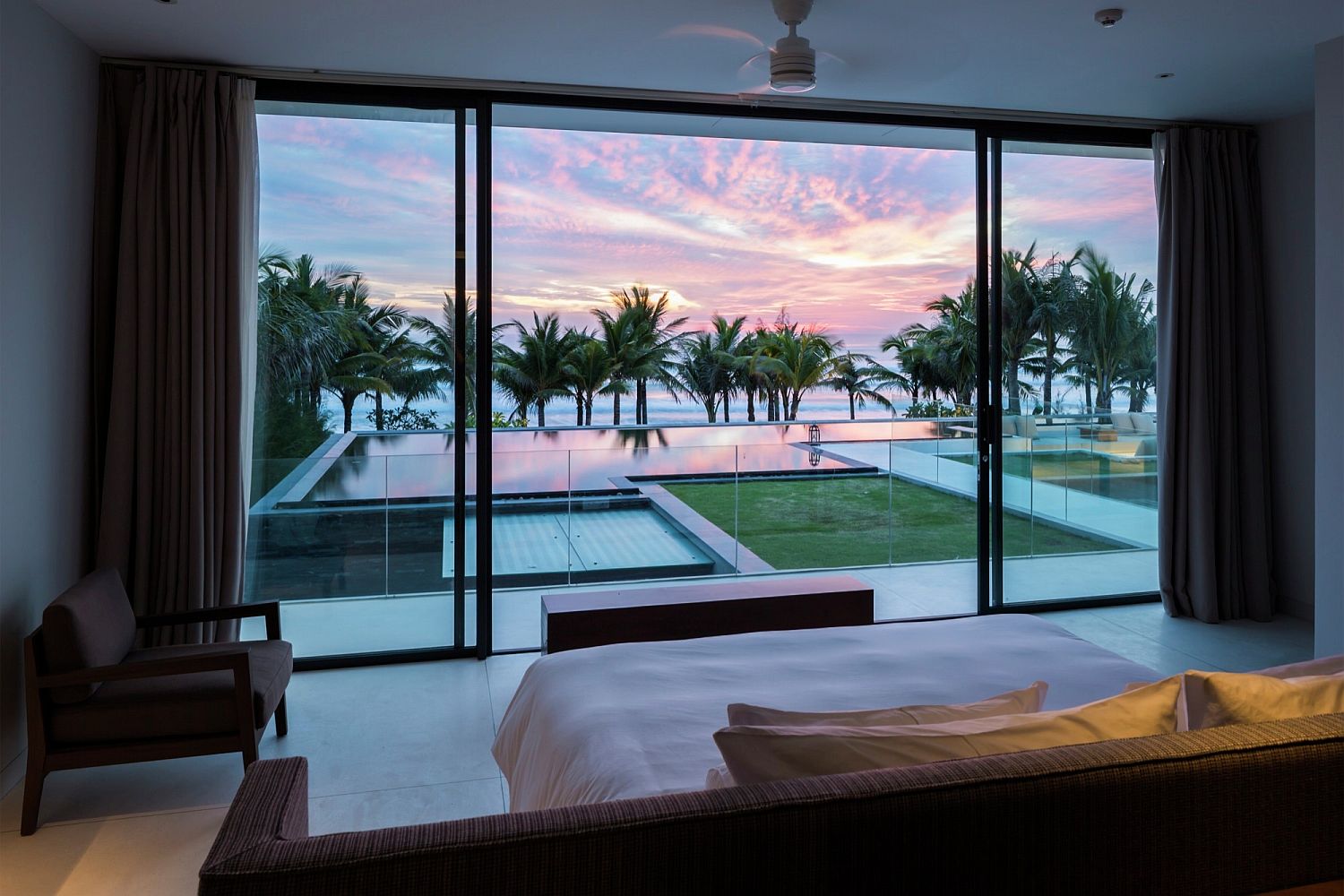 Mesmerizing-view-of-the-sea-and-the-distant-sunset-from-the-comfort-of-your-bedroom