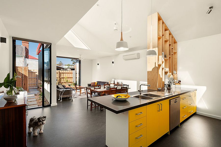 Open plan living area with kitchen and dining of the renovated Victorian home