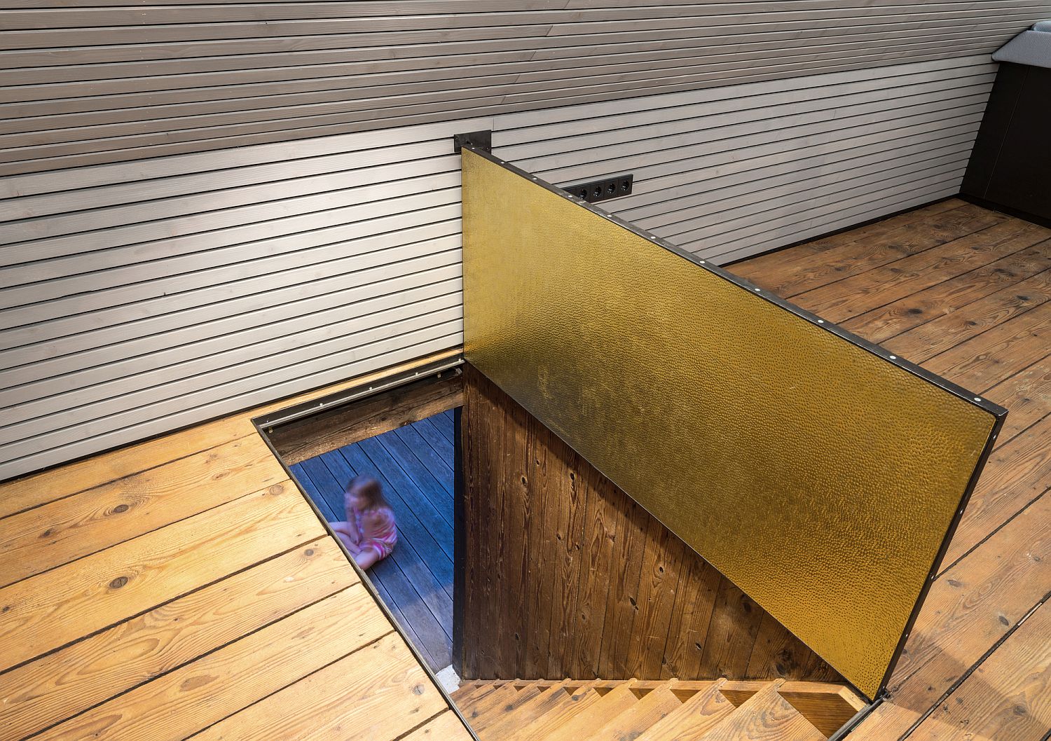 Small and cozy attic getaway with a brass trapdoor