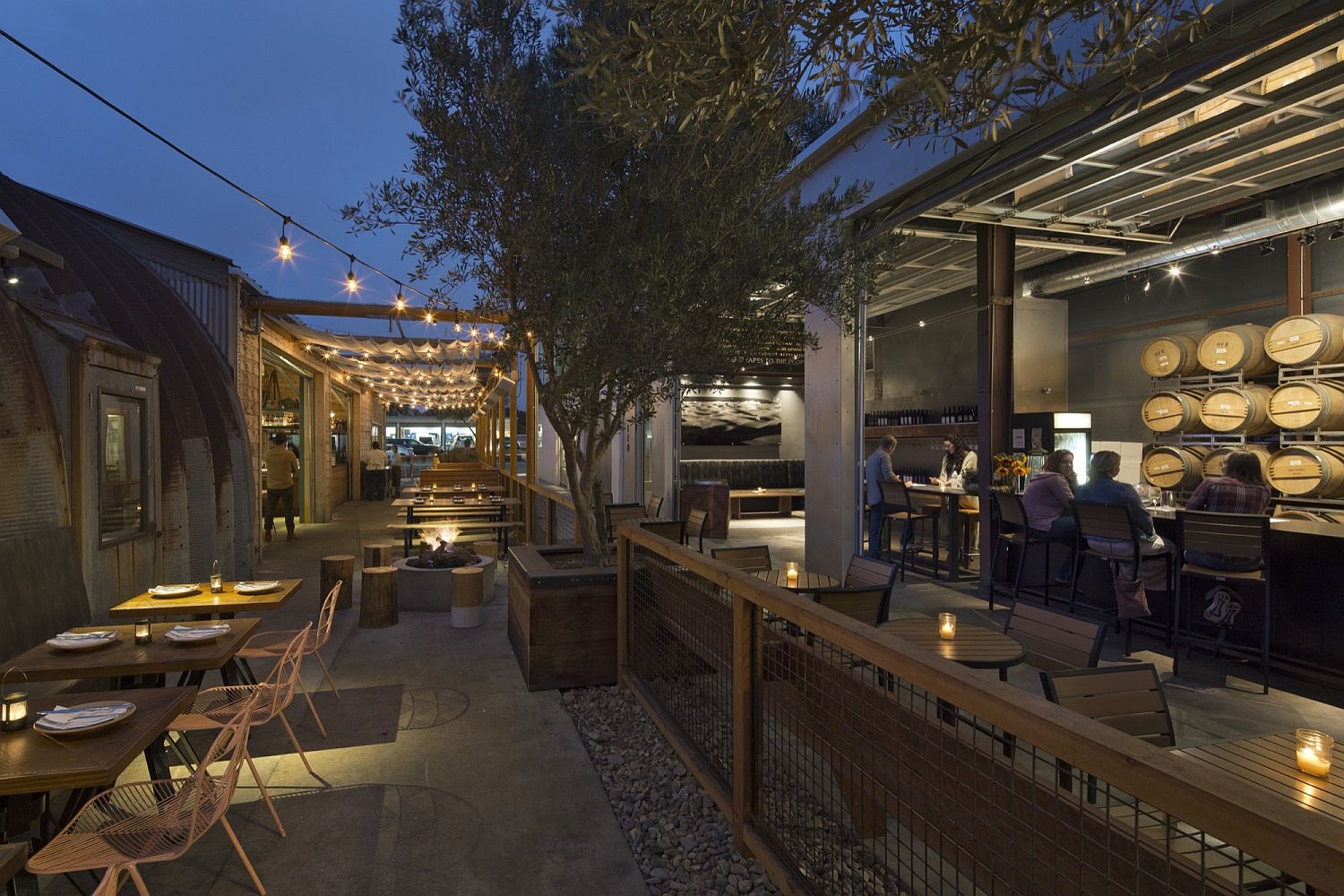 String lighting transforms the outdoor dining area and bar into a hip zone