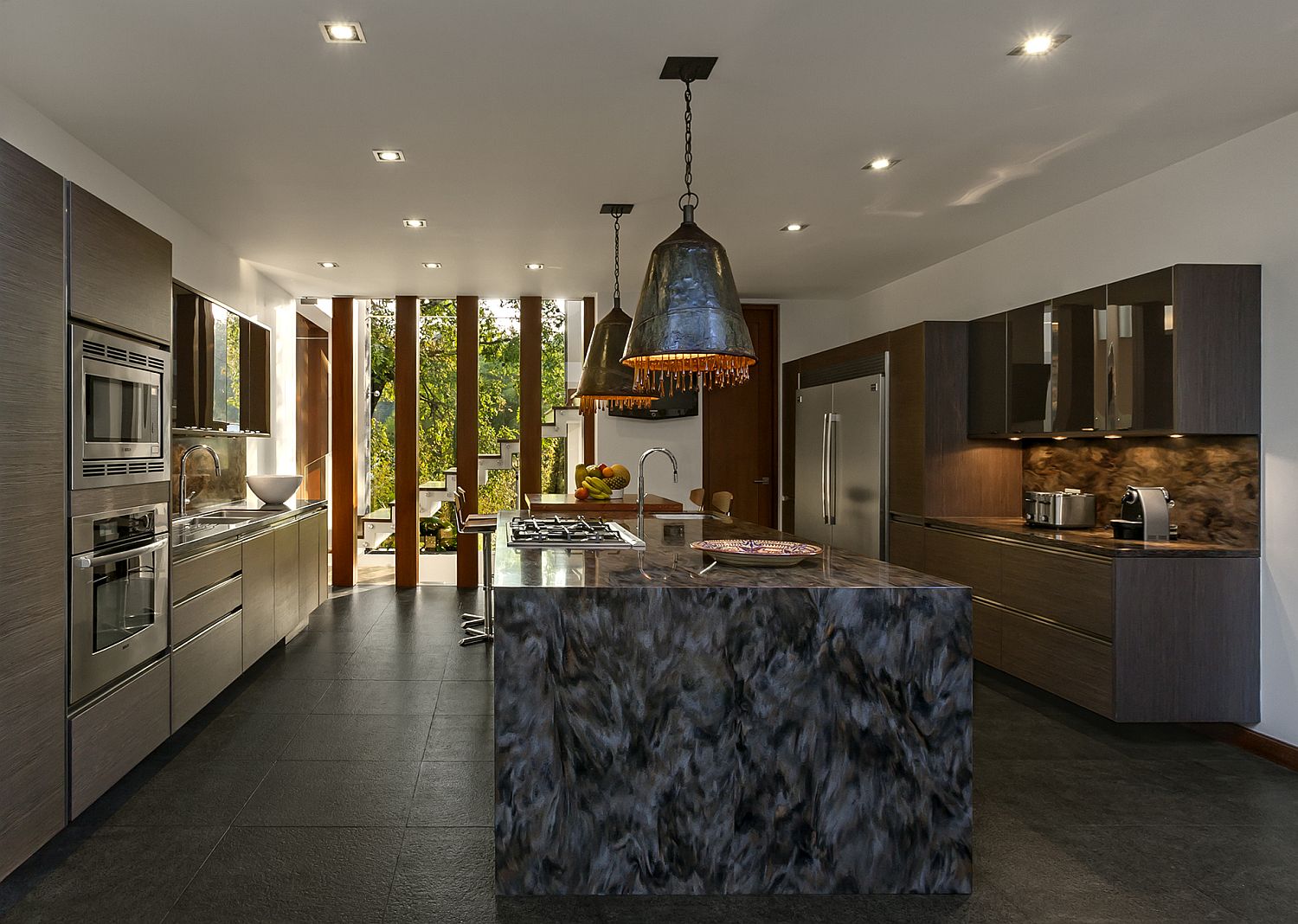 Unique pendants with metallic glint and custom kitchen island in stone