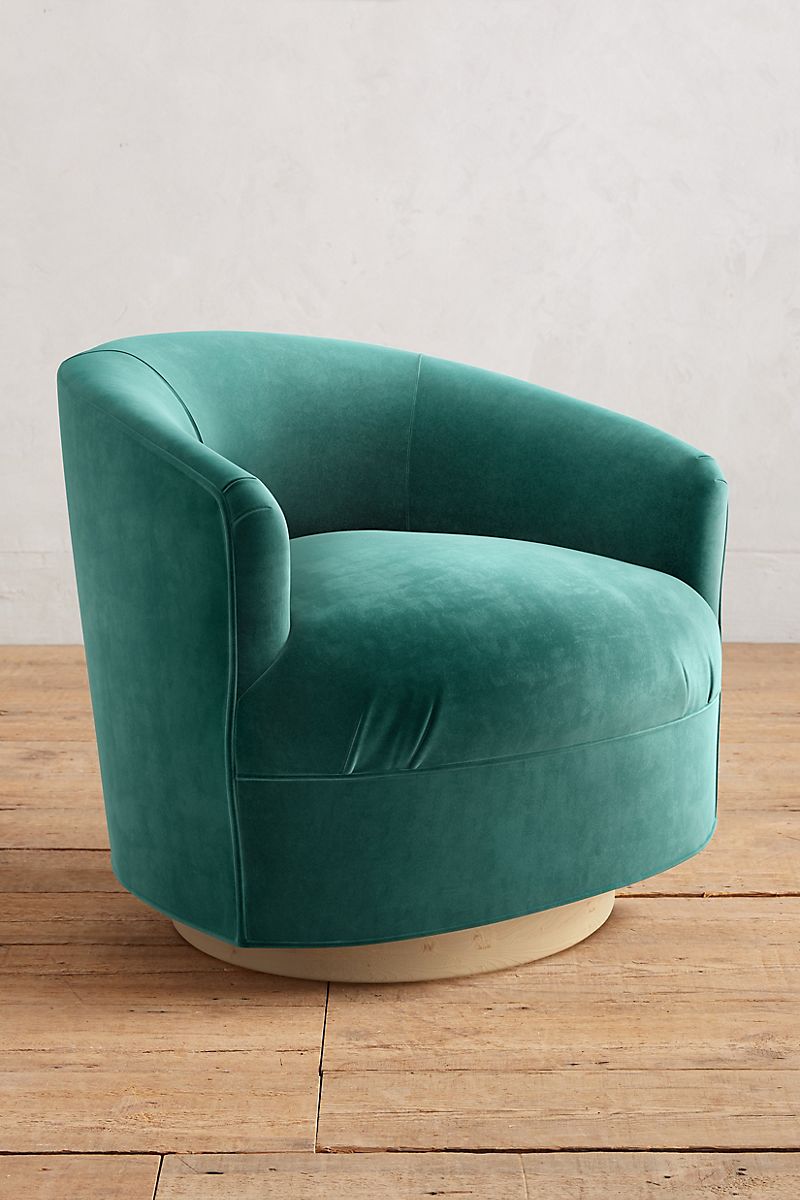 Velvet swivel chair in teal