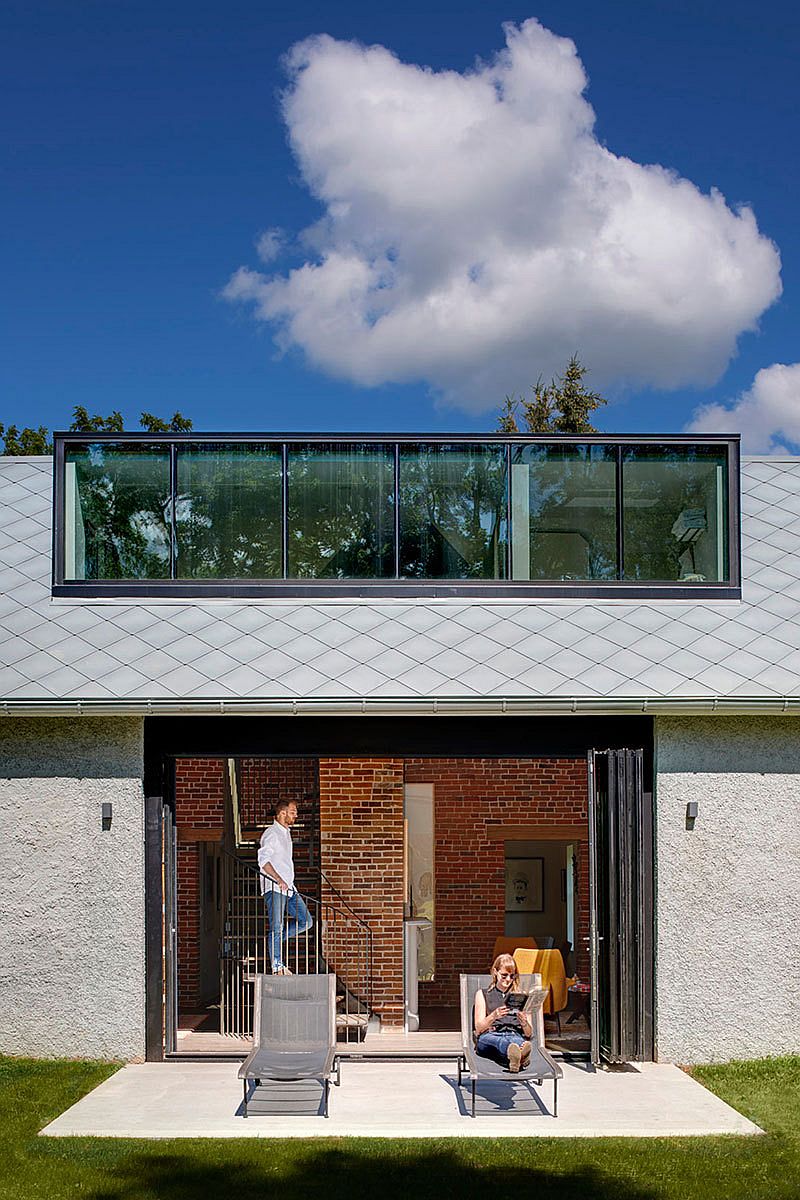 View of the new interior and the spiral stairway from the garden