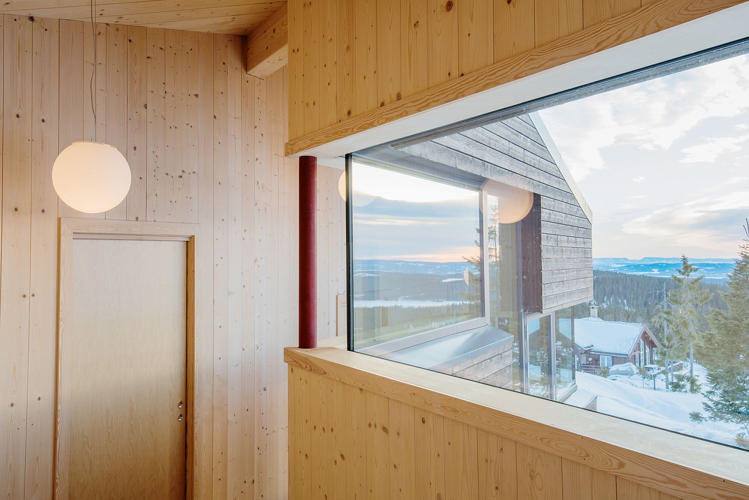 Warm wooden tones inside the cabin combine minimalism with relaxing elegance