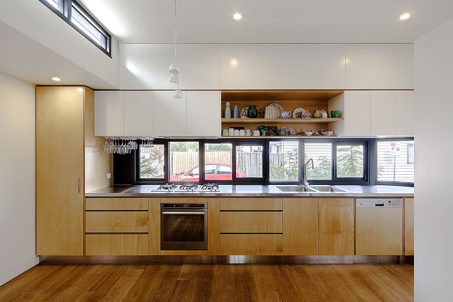 Wood-and-white-modern-kitchen-with-window-above-the-kitchen-counter