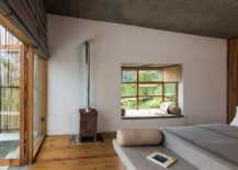 Wood-rustic-finsihes-and-bamboo-give-the-bedroom-of-the-Himalayan-hotel-a-cozy-appeal-217x155