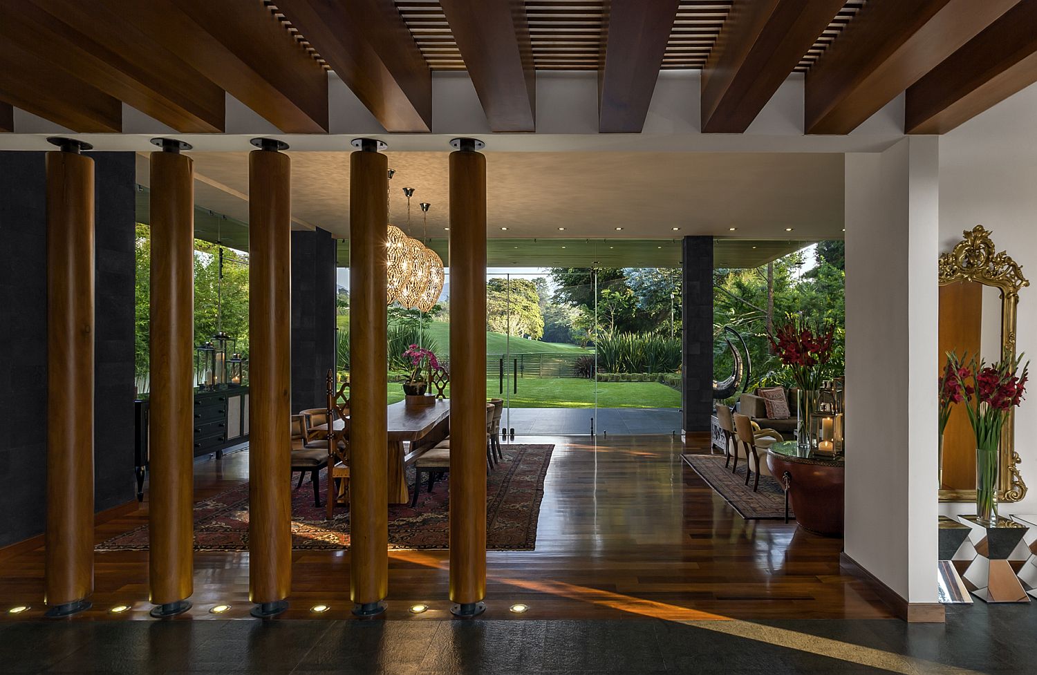 Wooden pillars act as cool and innovative room dividers