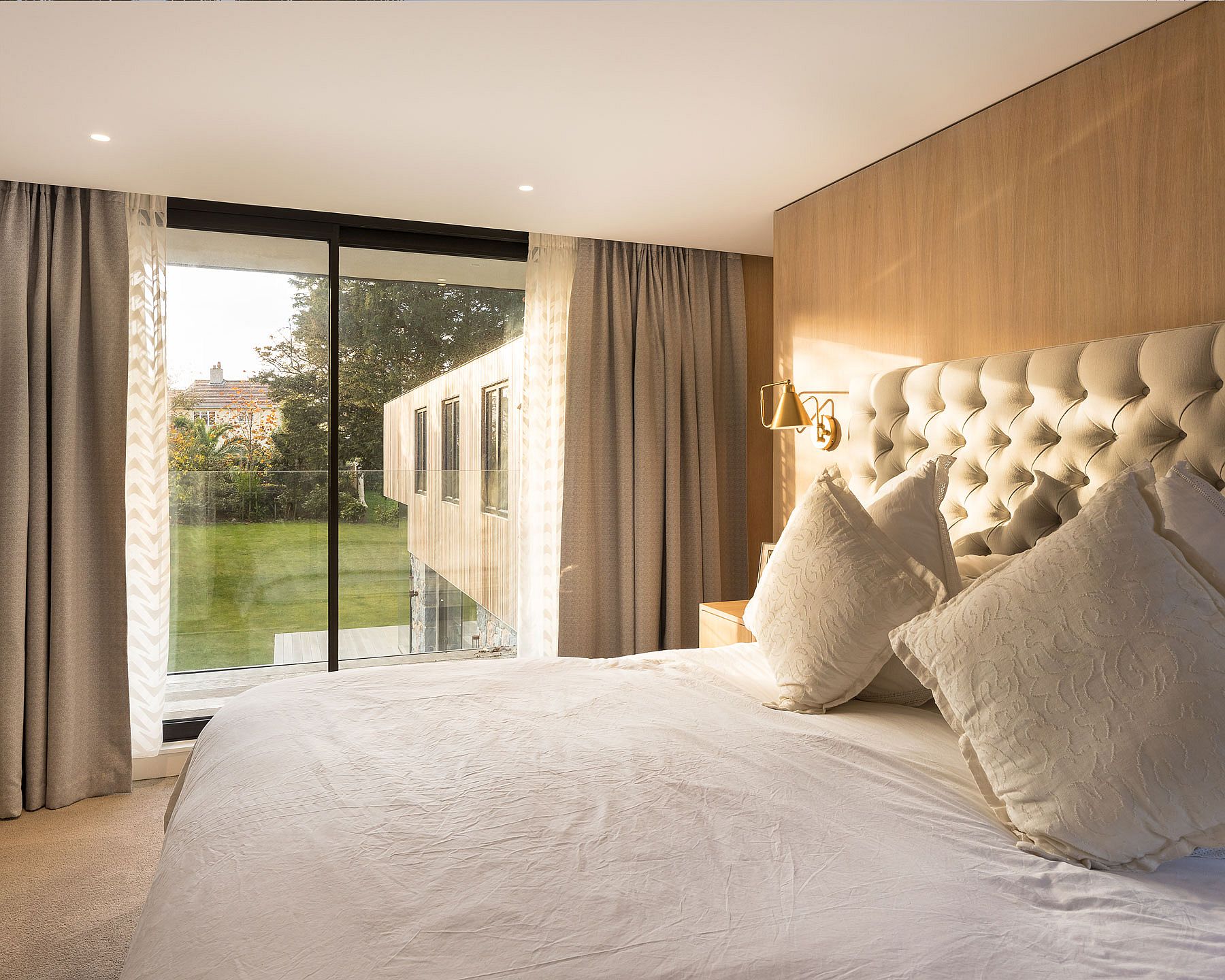 Bedroom of the British home flooded with natural light