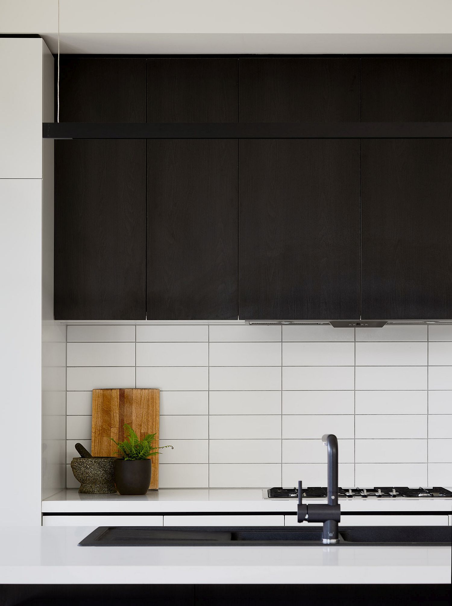 Black and white kitchen with wooden shelves