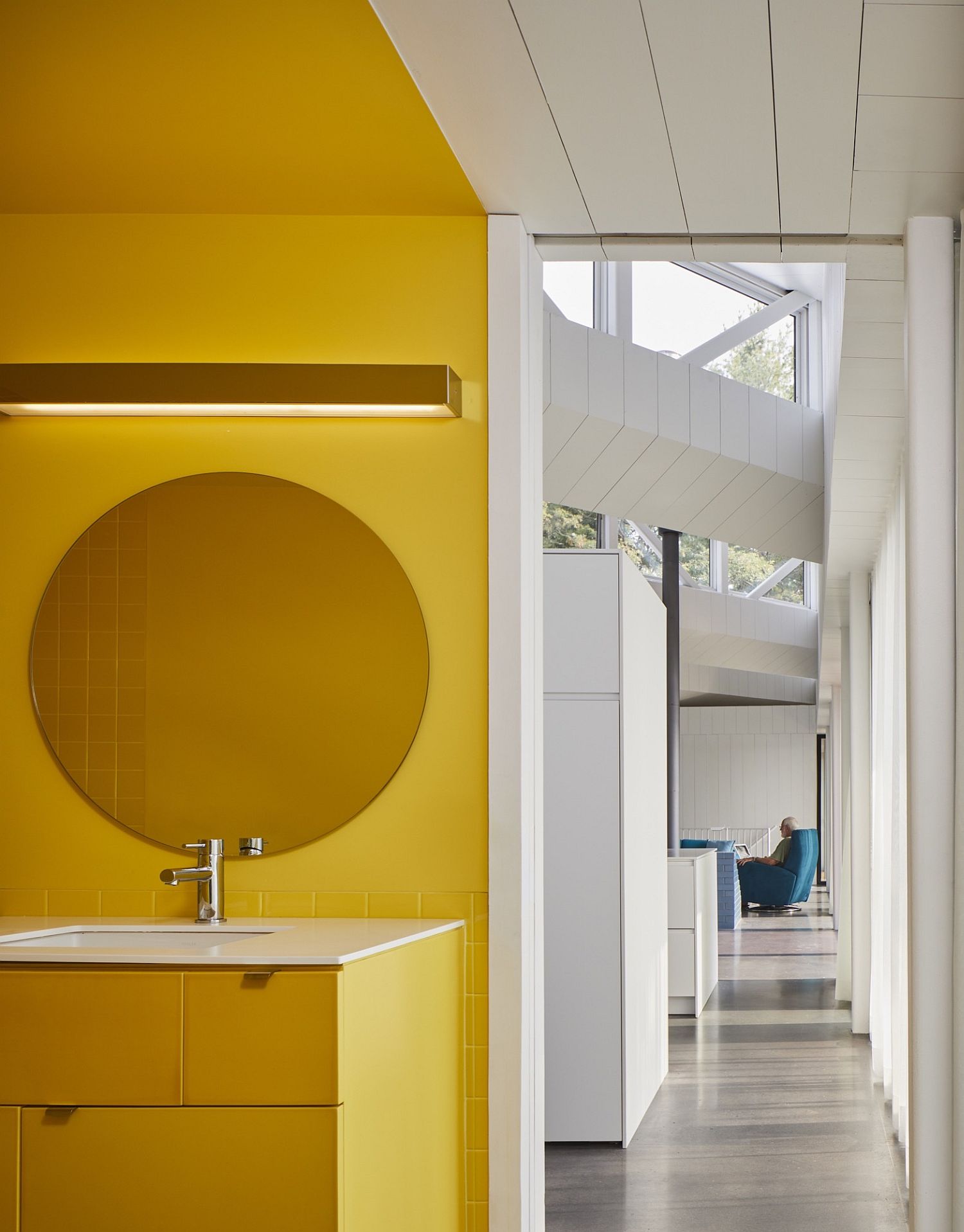 Bright yellow walls bring lively elegance to the interior