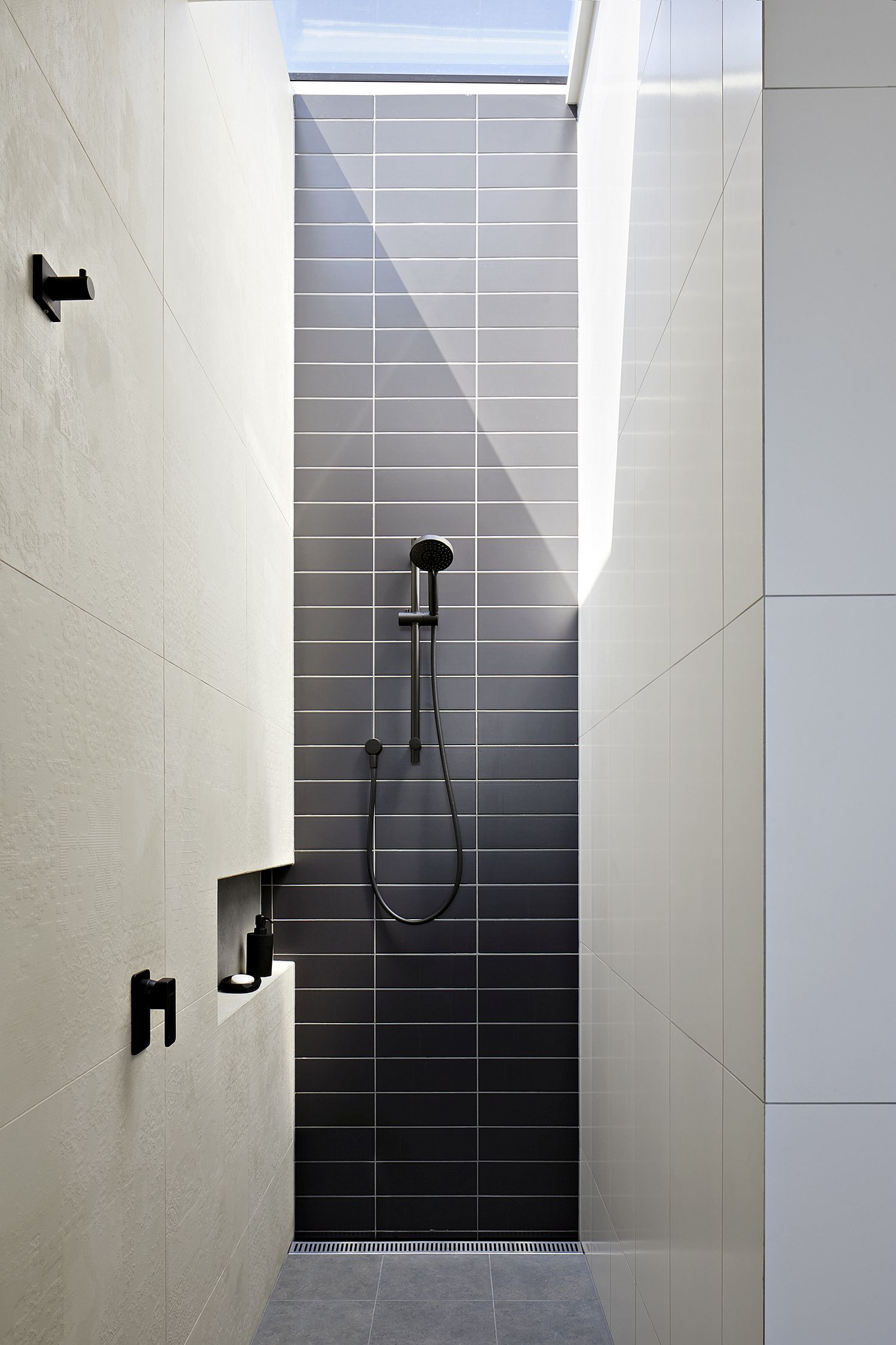 Bathroom in white and gray with skylight