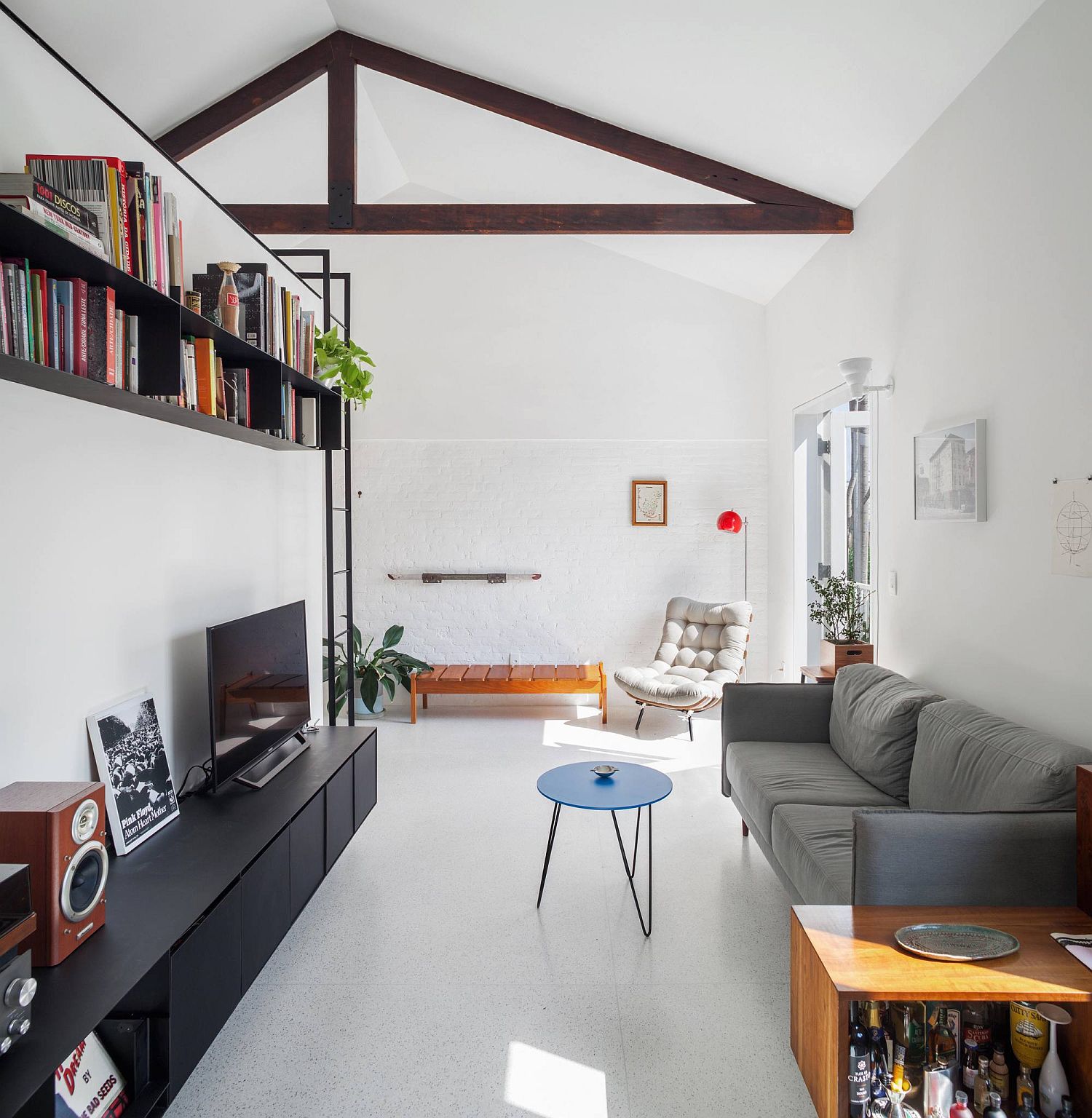 Exposed brick wall section painted white to create a uniform backdrop