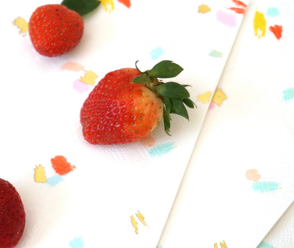 Fresh strawberries on napkins by Sugar & Cloth