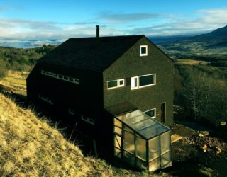 Sustainable Mountain Home in the Andes with a Dashing Dark Exterior