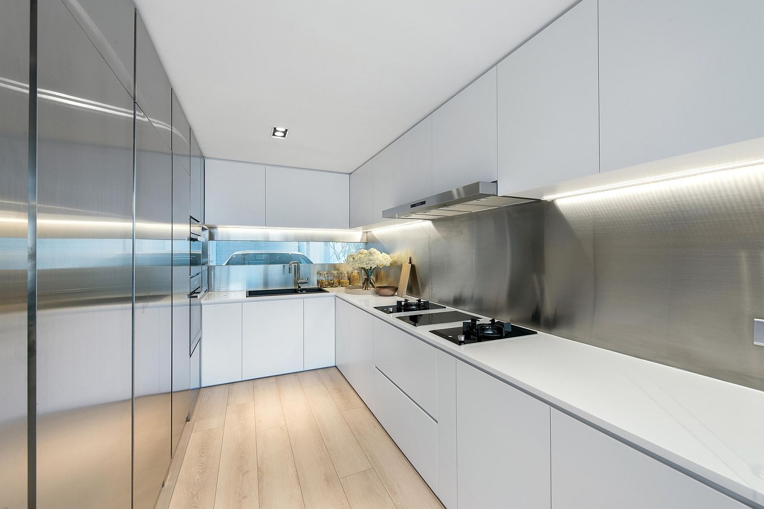 Metallic finishes along with white inside the modern kitchen