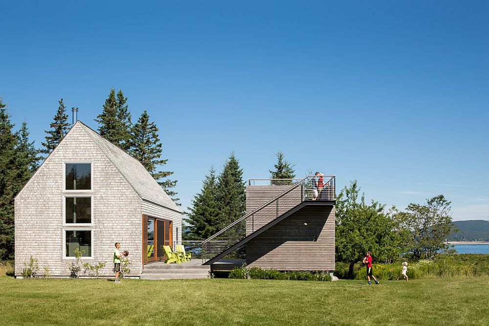 Modern structure next to 100 year old farmhouse with ocean views