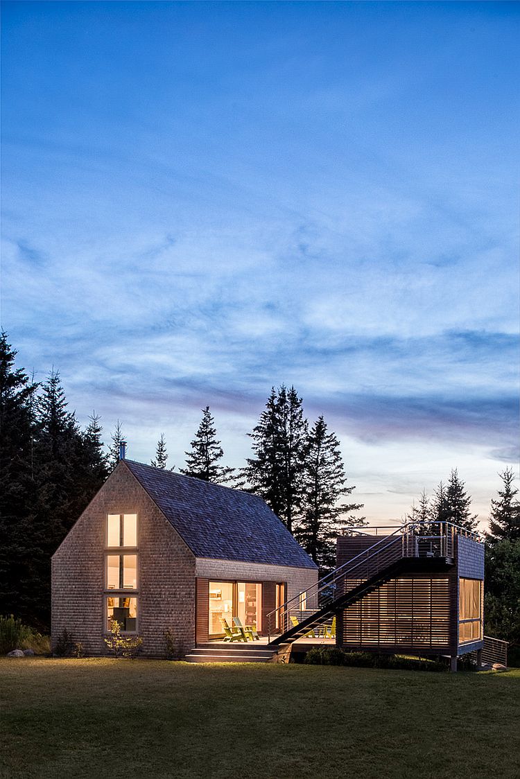 Old cottage and smaller modern structure next to it in Maine next to the ocean