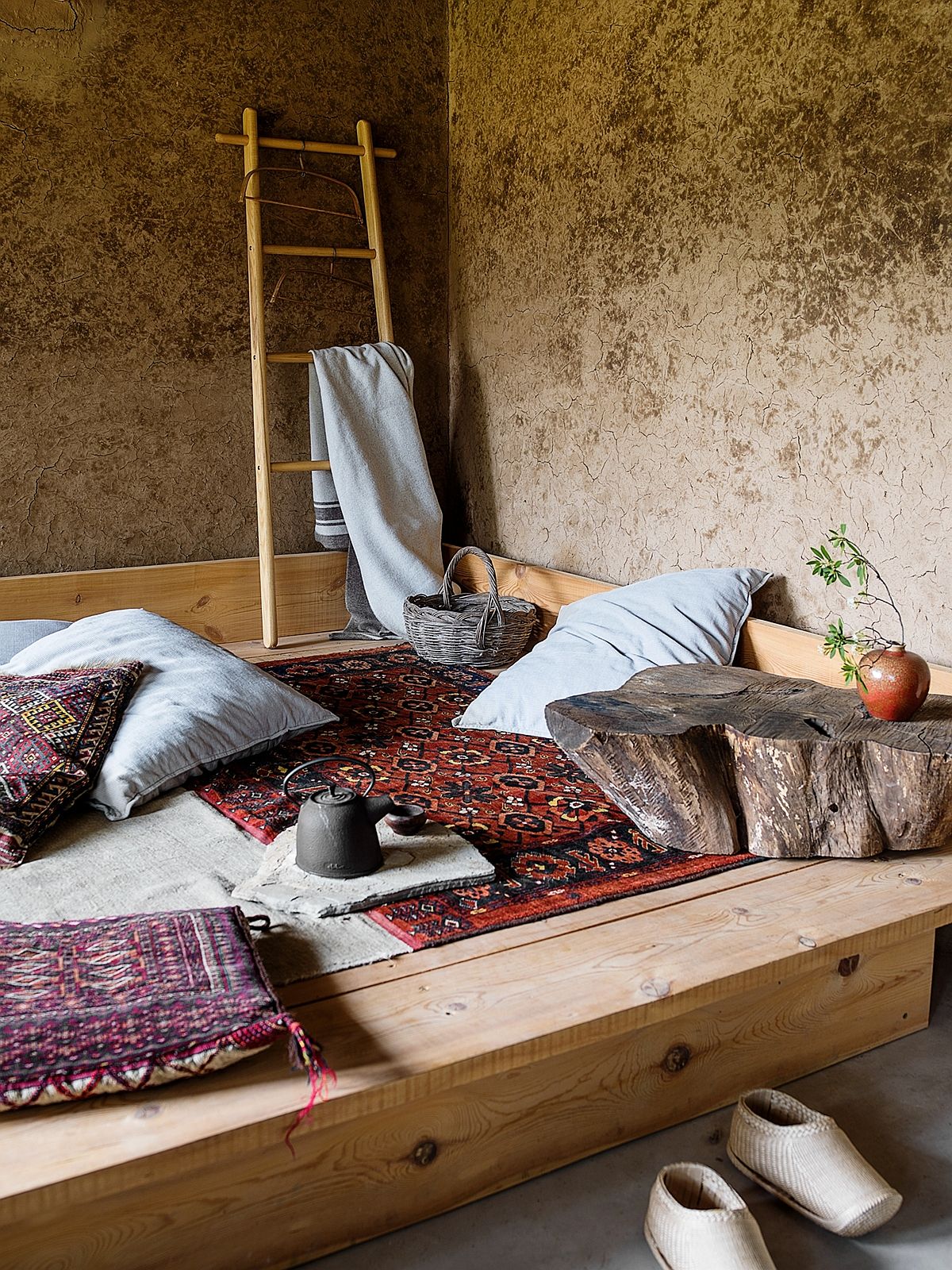 Relaxing sitting space with wooden bench on the floor