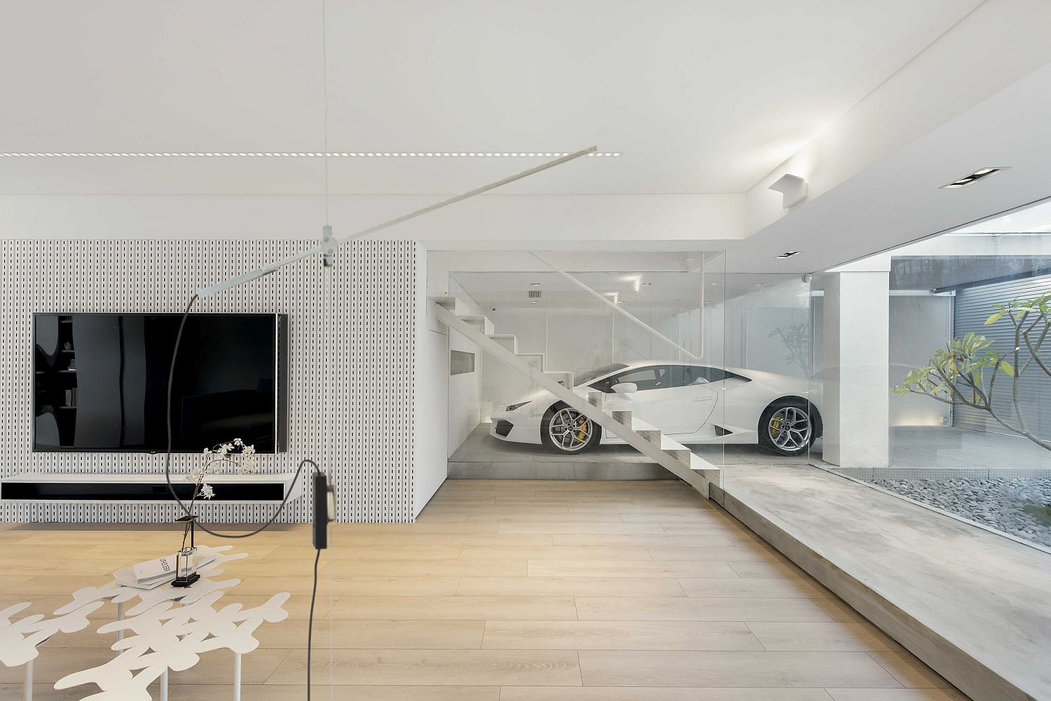 Transparent-garage-of-the-Hong-Kong-showcases-proudly-the-homeowners-car