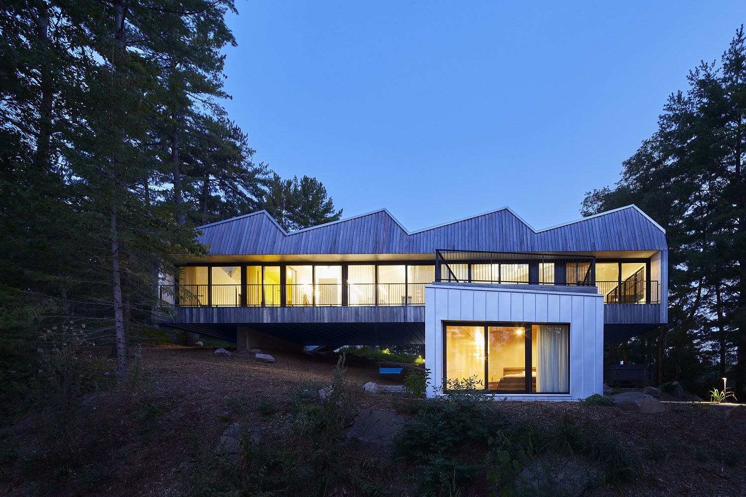 Unique metallic roof and wooden exterior of the Canadian home